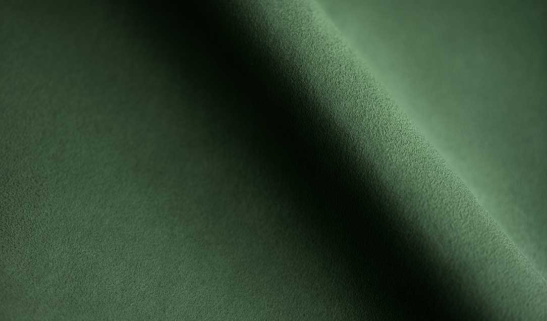 Experience the Elegance of amaretta™ in Dark Green  Discover the unmatched sophistication of our high-quality man-made leather. This ultra-fine material is crafted to perfection, offering a luxurious feel and exceptional durability. Ideal for a wide range of applications, our man-made leather is perfect for garments, footwear, linings of any kind, sports equipment and decorative purposes.  Whether you are designing elegant jackets, stylish shoes, or chic interior decor, this versatile material meets all your creative needs. Additionally, our man-made leather is available in various colors, allowing you to choose the perfect shade for your project. Embrace the beauty and versatility of our premium man-made leather and elevate your designs to new heights.