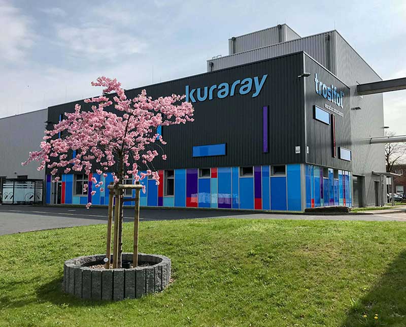 Cherry blossoms in front of production building